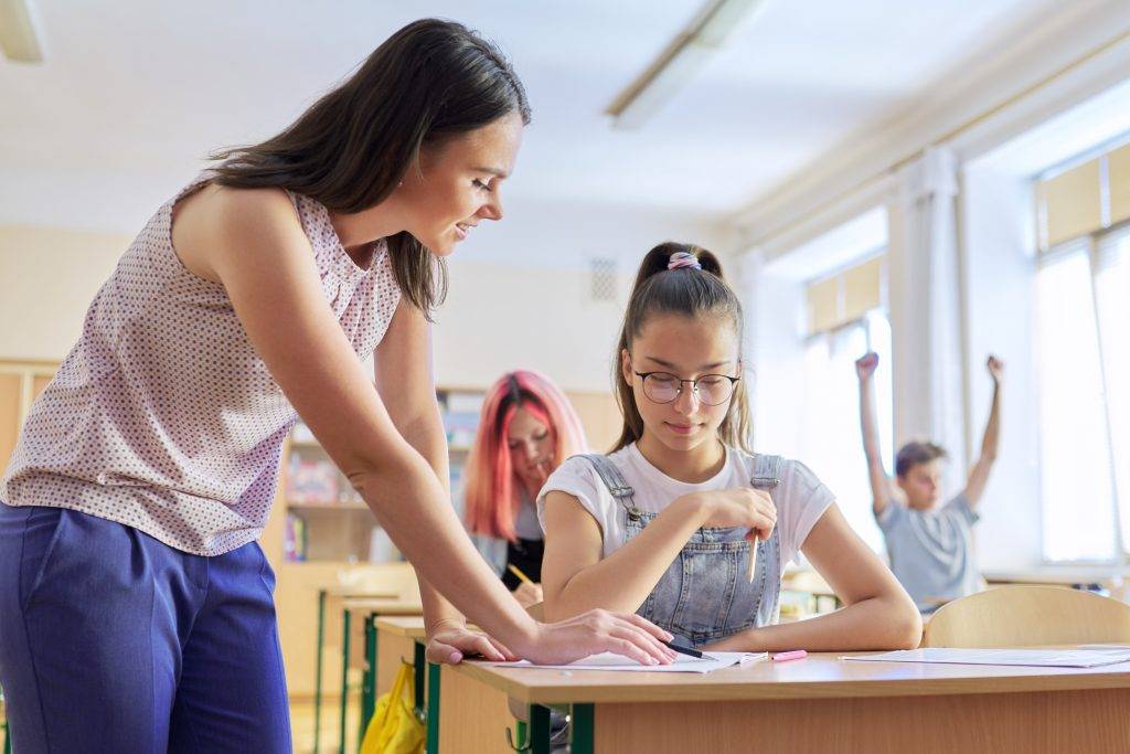 young woman teacher teaches lesson in class of tee 2022 02 22 04 30 51 utc